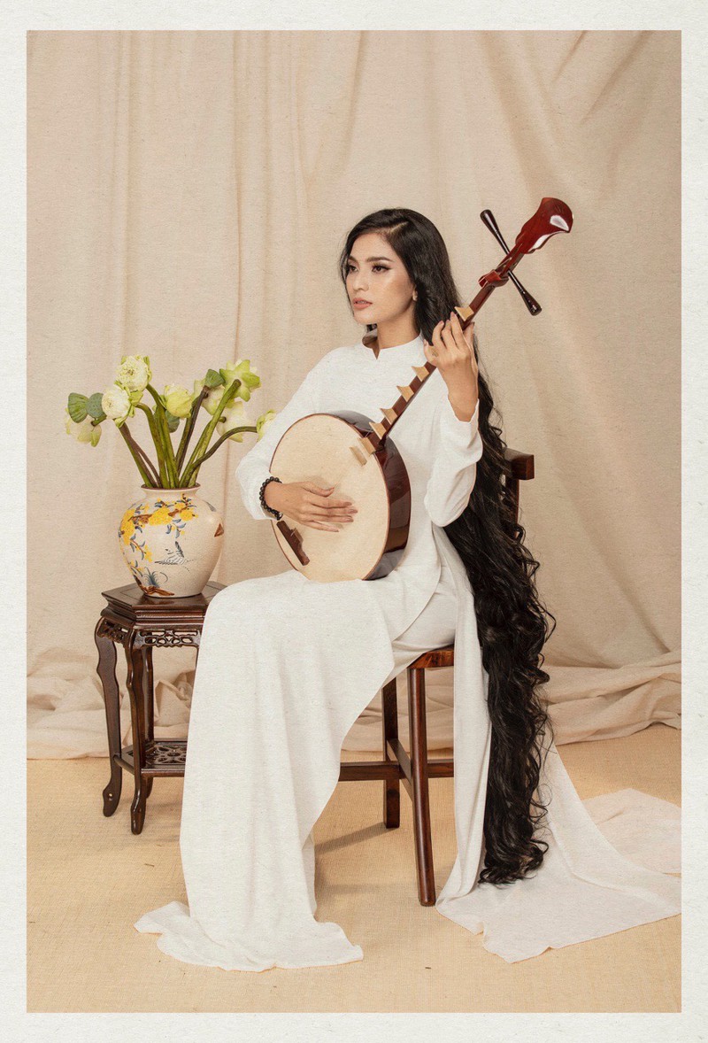 truong thi may dep duyen dang trong trang phuc ao dai me may hinh 5
