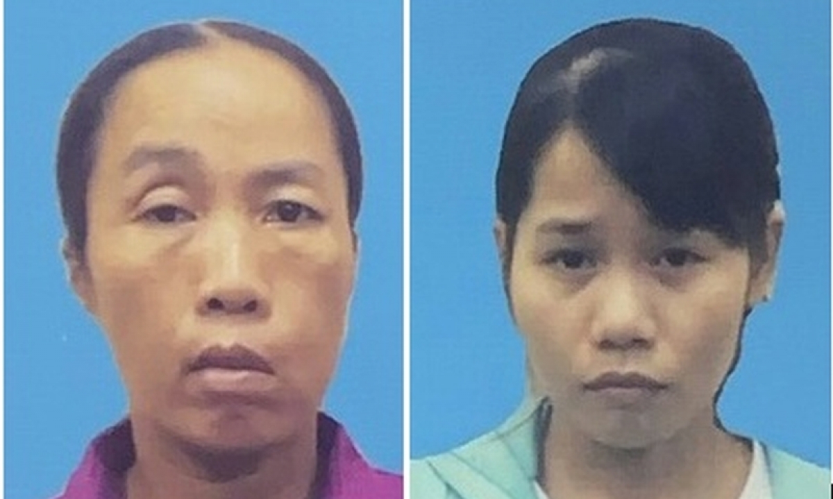 Trần Thị Cẩm (trái) và Trần Thị Thu Hà (phải) tại cơ quan công an. Ảnh: Công an cung cấp