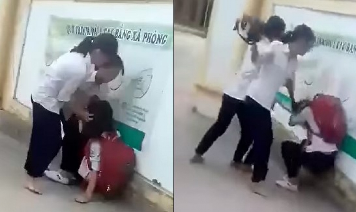 Nữ sinh bị nhóm bạn đánh đập (ảnh cắt từ clip).