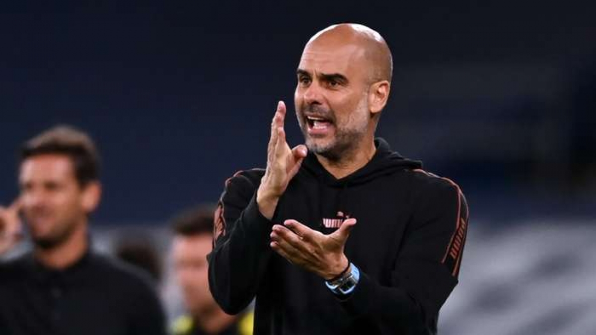HLV Pep Guardiola muốn gắn bó với Man City lâu hơn nữa (Ảnh: Getty).