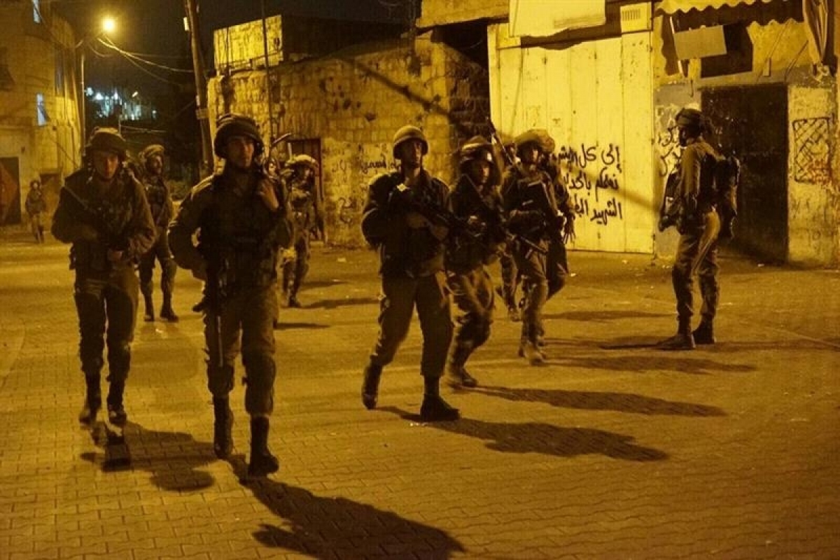 Quân đội Israel đột kích Bờ Tây (Ảnh: WAFA News Agency)