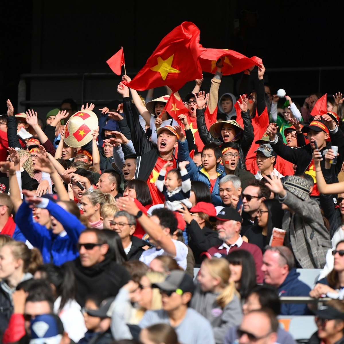 An image showing Vietnamese national flags waving in the stands of Eden Park in Auckland in New Zealand on July 22