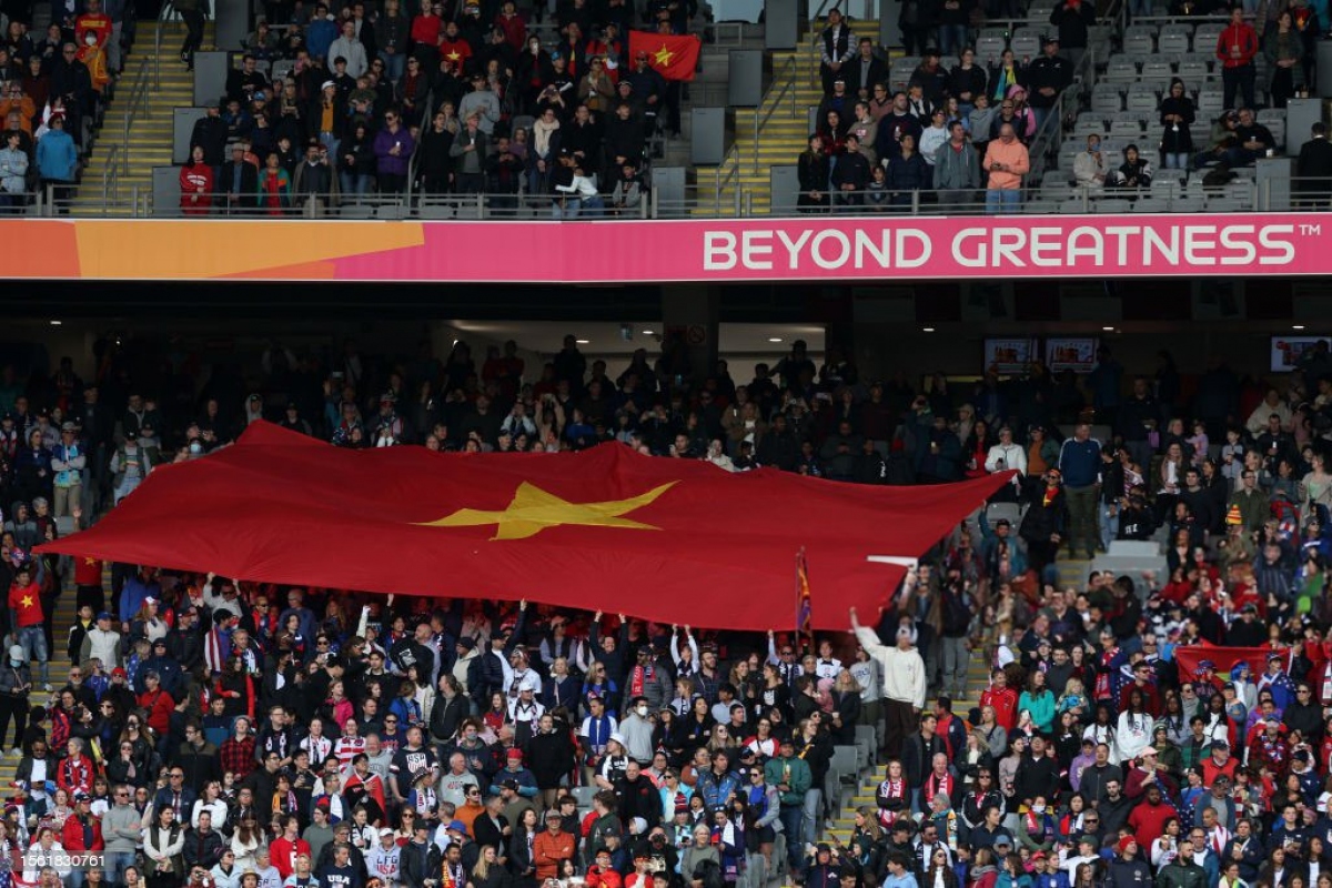A photo records the emotional moment for millions of football fans in Vietnam when the national flag is waved in the stands and the national anthem is sung at World Cup.