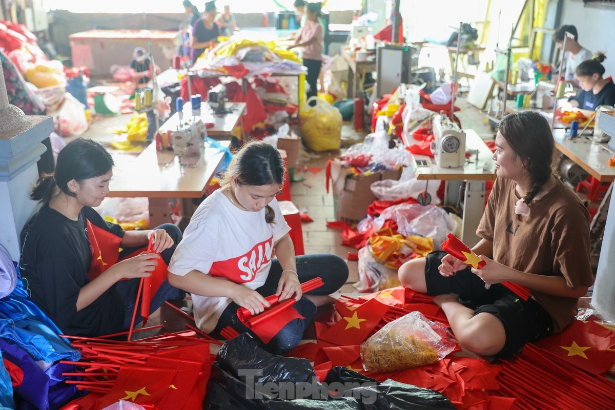 The tailors have to be meticulous in their work as they strive to make national flags in full accordance with state regulations.