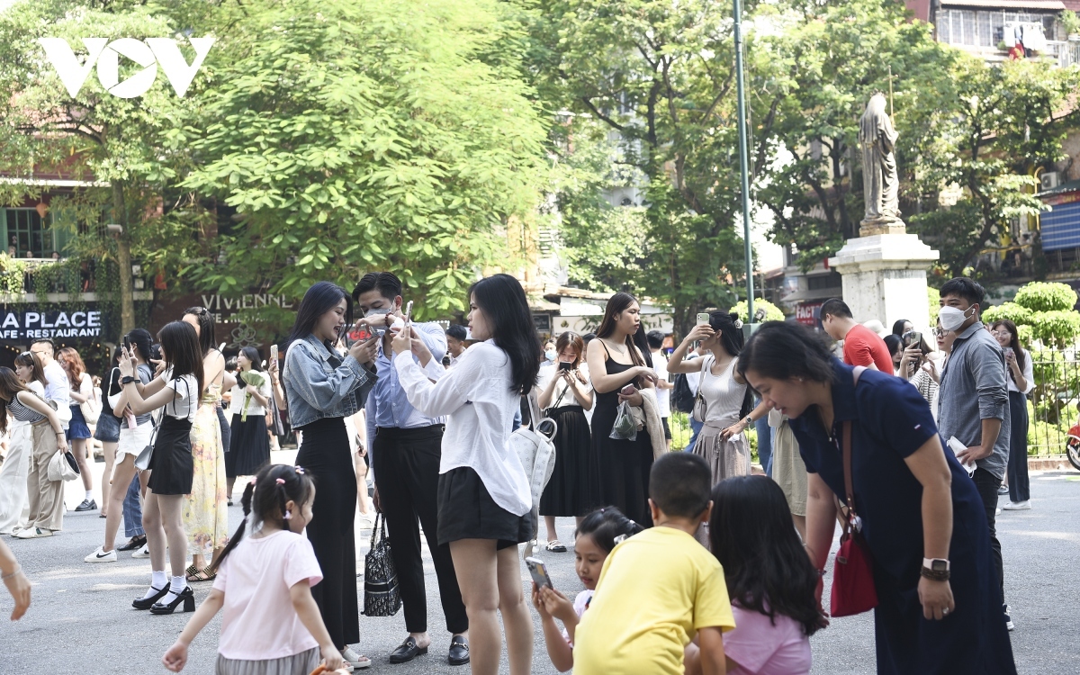 Young people take time to pose for pictures at the famous cultural site