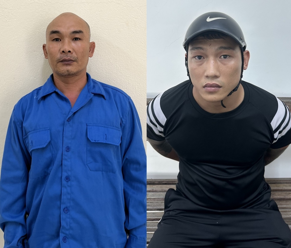  Lê Văn Sinh Nhật (trái) và Nguyễn Quang Nam bị bắt giữ