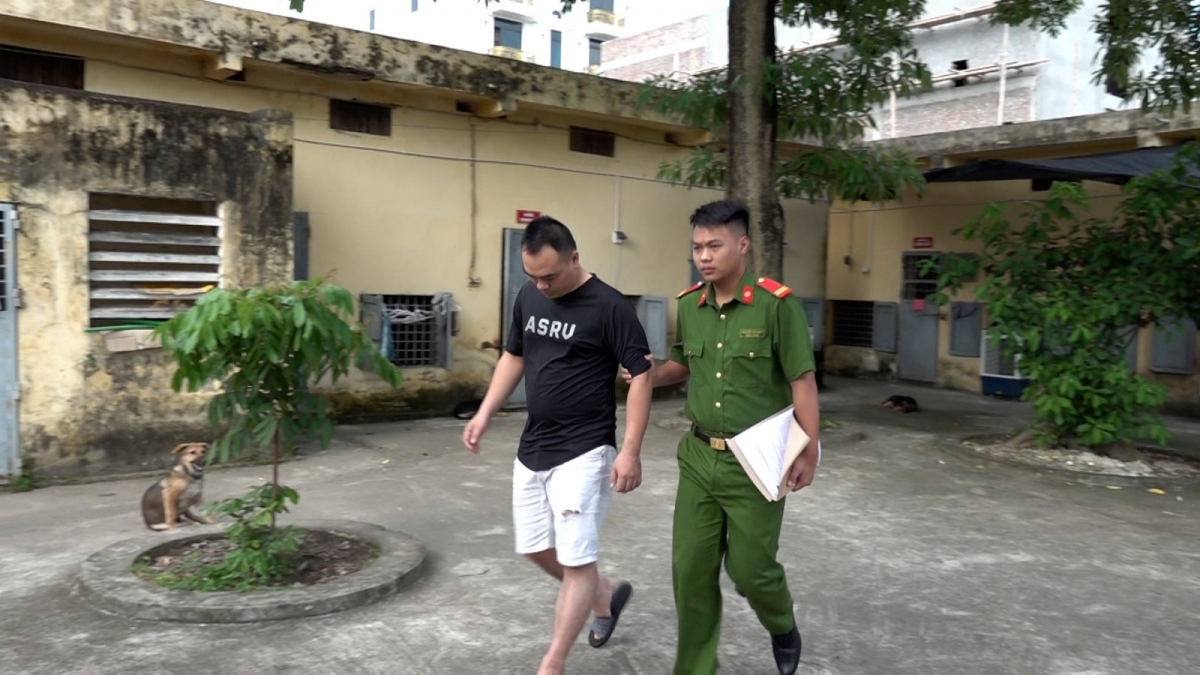 Vũ Ngọc Minh tại cơ quan công an.