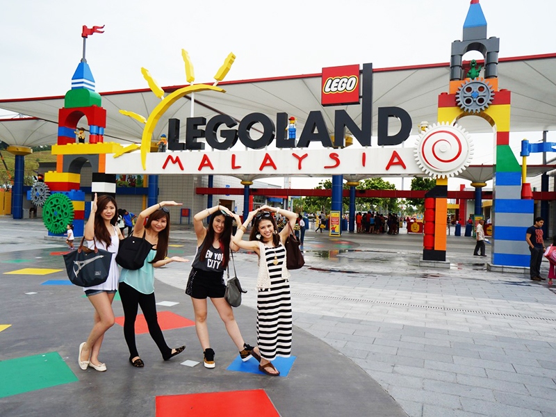 A group of tourists pose for a photo at Legoland-one of famous tourist attractions in Malaysia