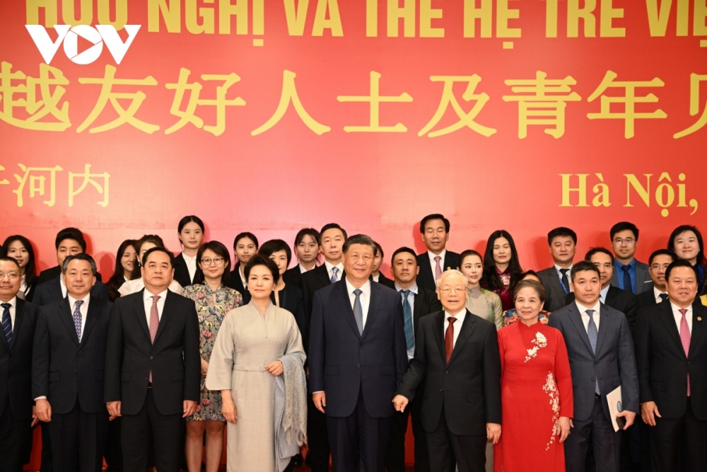 The top two Party leaders and their wives attend an exchange between intellectuals and young people of Vietnam and China.