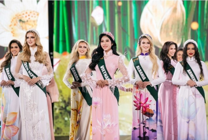 Miss Earth 2023 finalists look graceful during an Ao Dai (Vietnamese traditional long dress) performance in the grand final.