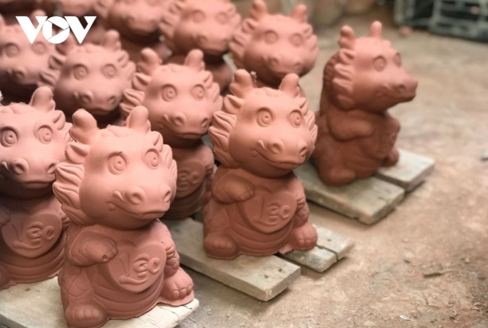 A workshop is at its busiest ahead of the Lunar New Year holiday, which falls on February 10 this year, with thousands of dragon-shaped items being churned out each day.