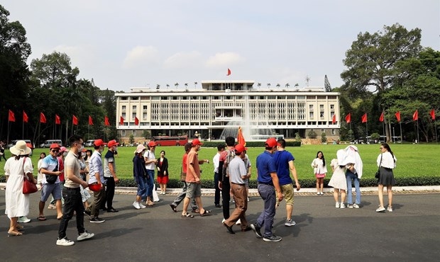 Tourists visit Ho Chi Minh City's Independence Palace