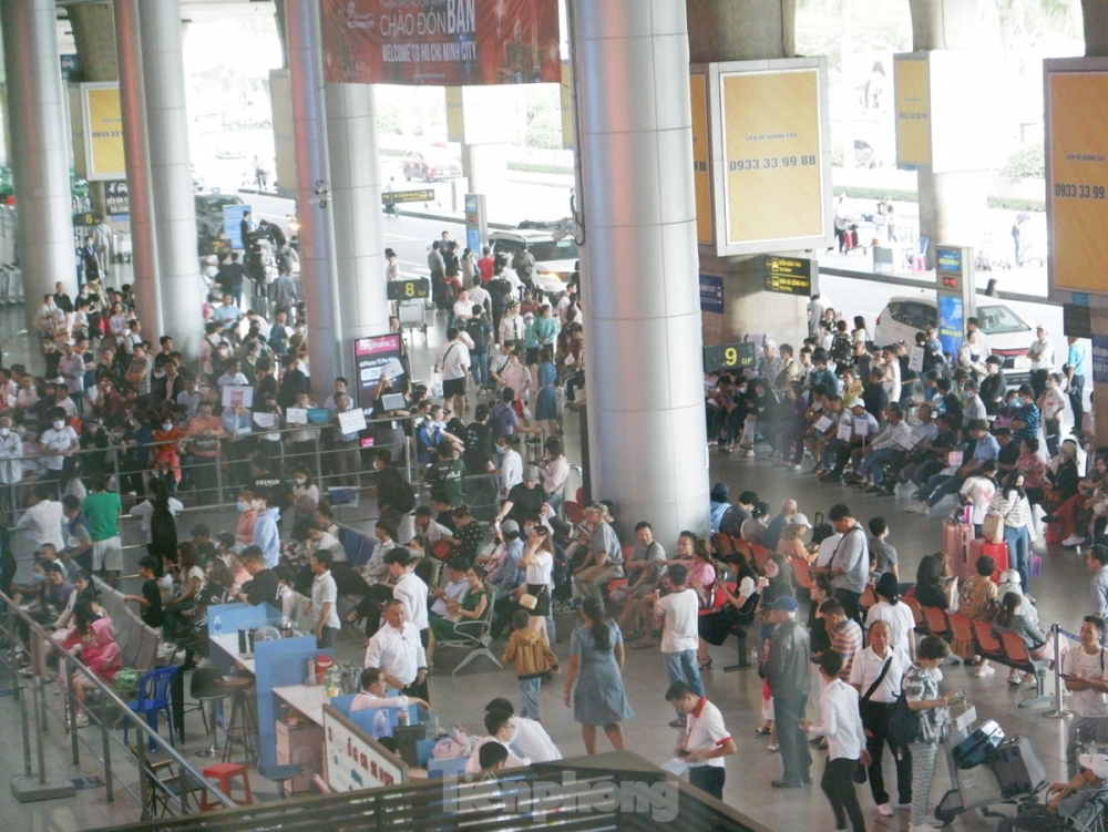 People wait for their overseas Vietnamese relatives at the arrival hall of the international terminal at Tan Son Nhat International Airport in Ho Chi Minh City.