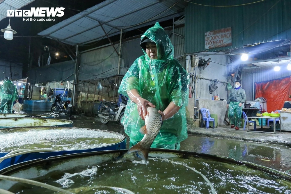 A trader makes a living at Yen So market.
