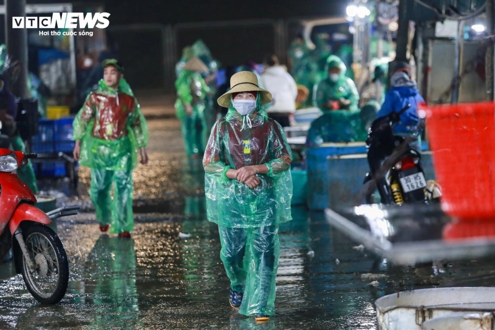 Many traders don raincoats as they struggle to cope with the chilly winter weather conditions which have hit the capital.