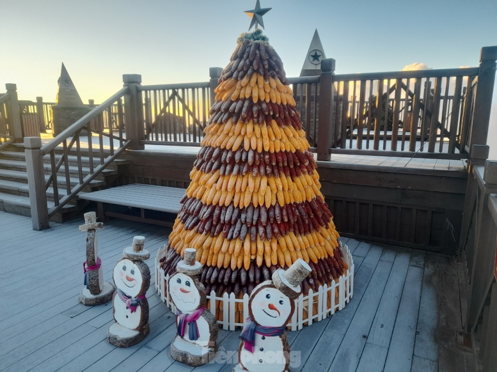 Frost covers snowmen on top the mountain.