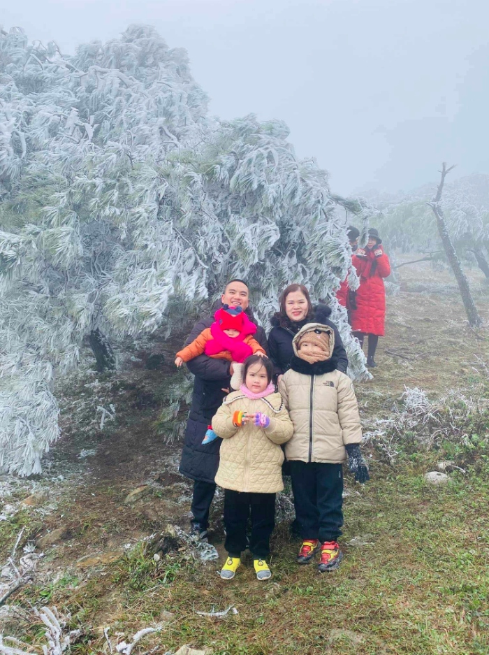 Visitors wrap up warm as they venture into the winter landscape and pose for photos.