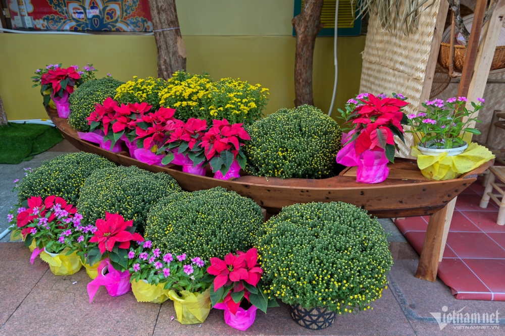 A boat carrying fresh flowers features Tet celebrations in the Mekong Delta region.