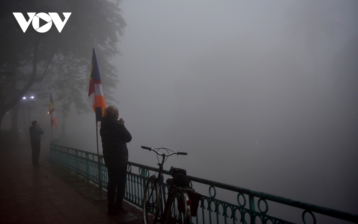 Residents venturing out for morning exercises still feel chill due to high humidity and freezing fog.