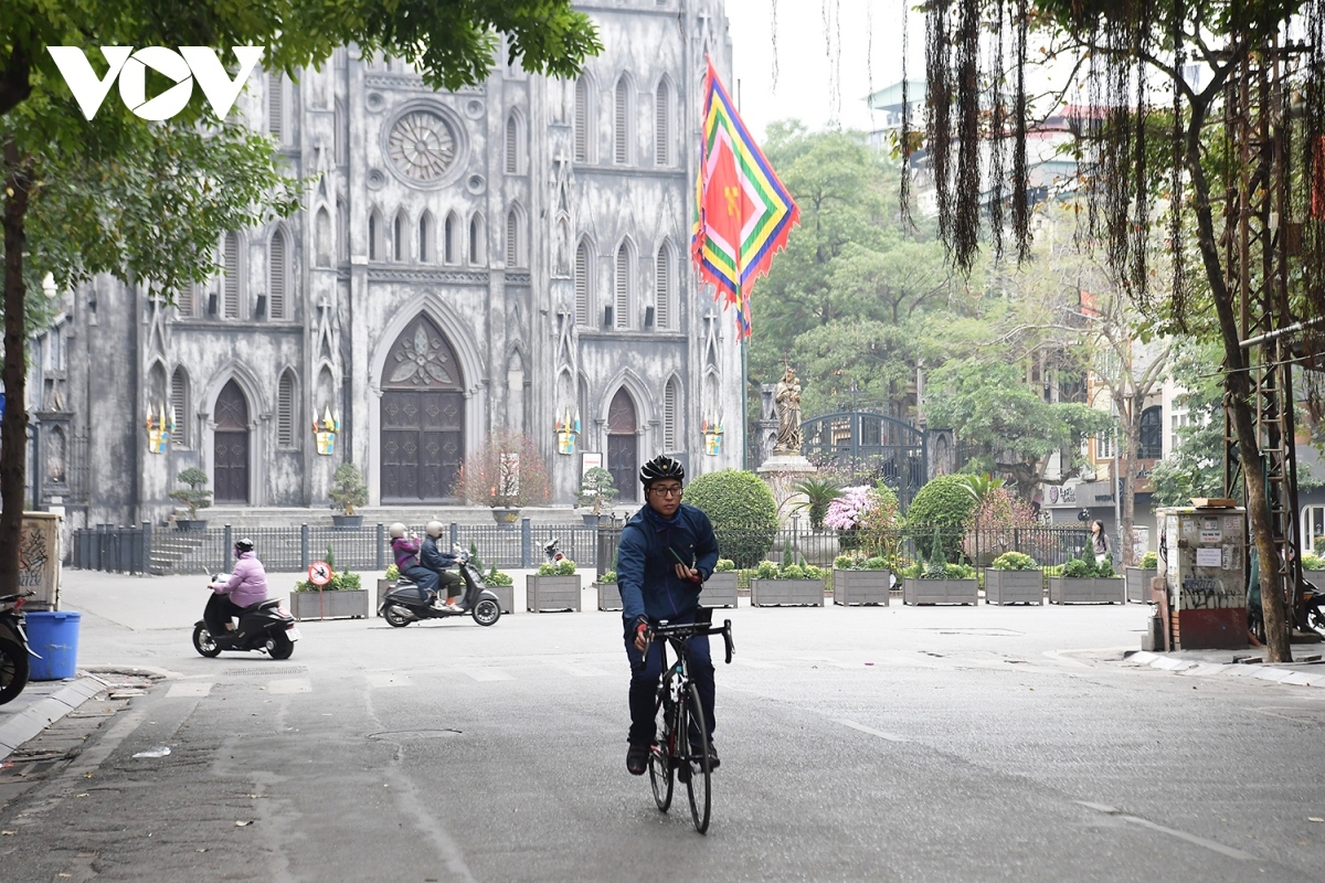 The St. Joseph’s Cathedral, which is usually packed with residents and tourists, sees few people ride bicycles and motorbikes.