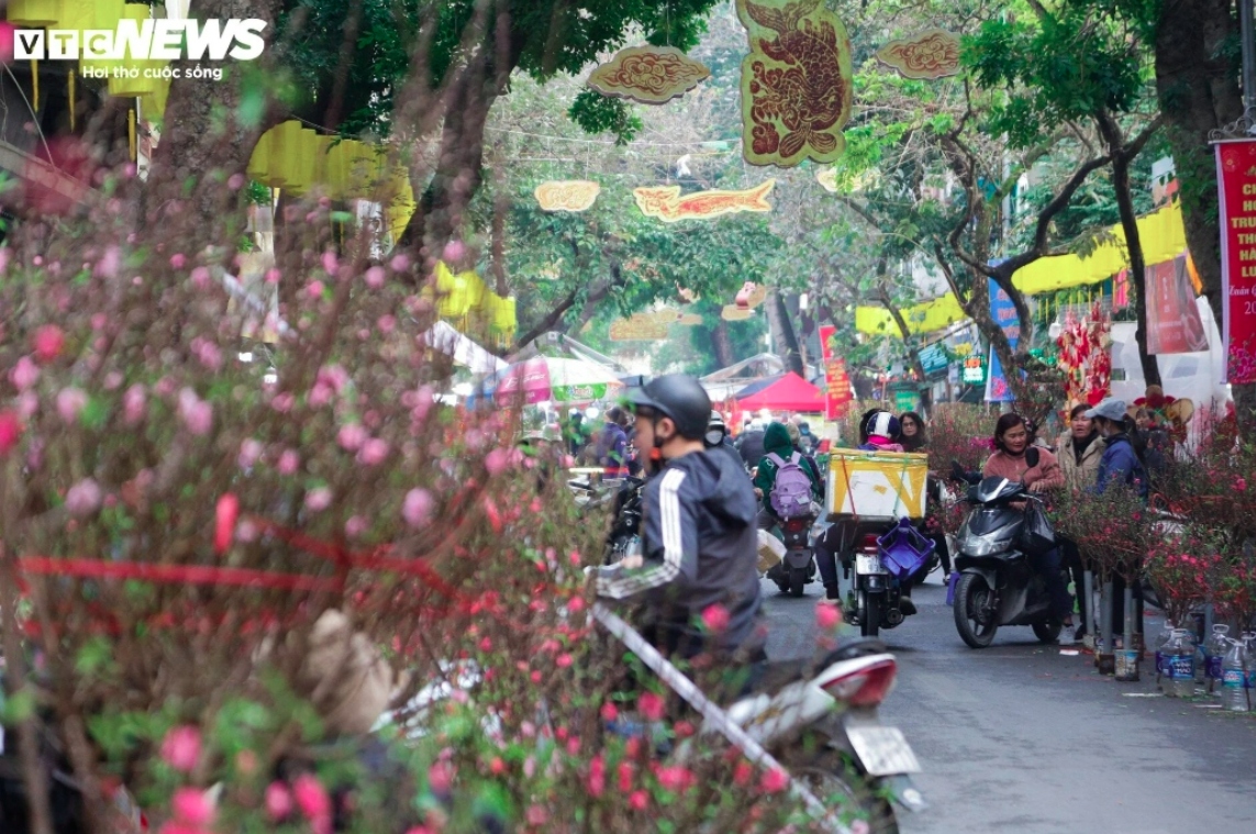 Many customers drive along the streets by motorbike as they select the perfect flowers and decorative items for their homes.