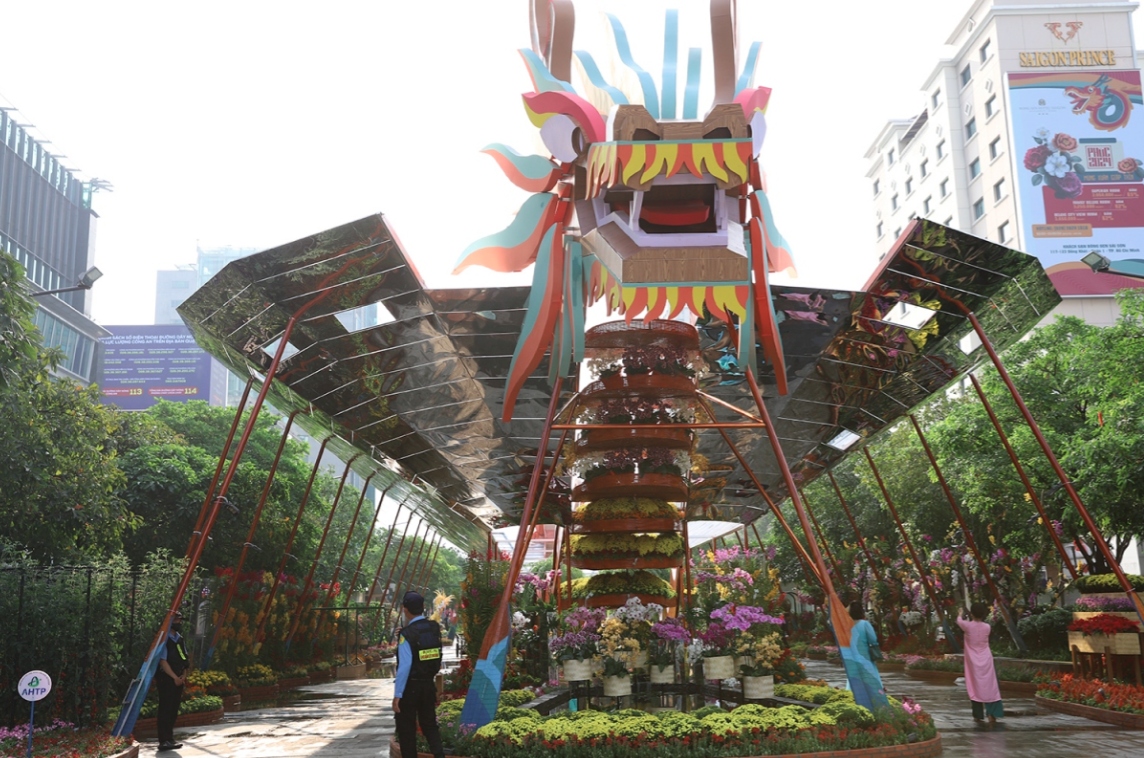 A large number of potted flowers are transported to the venue as part of the decoration.