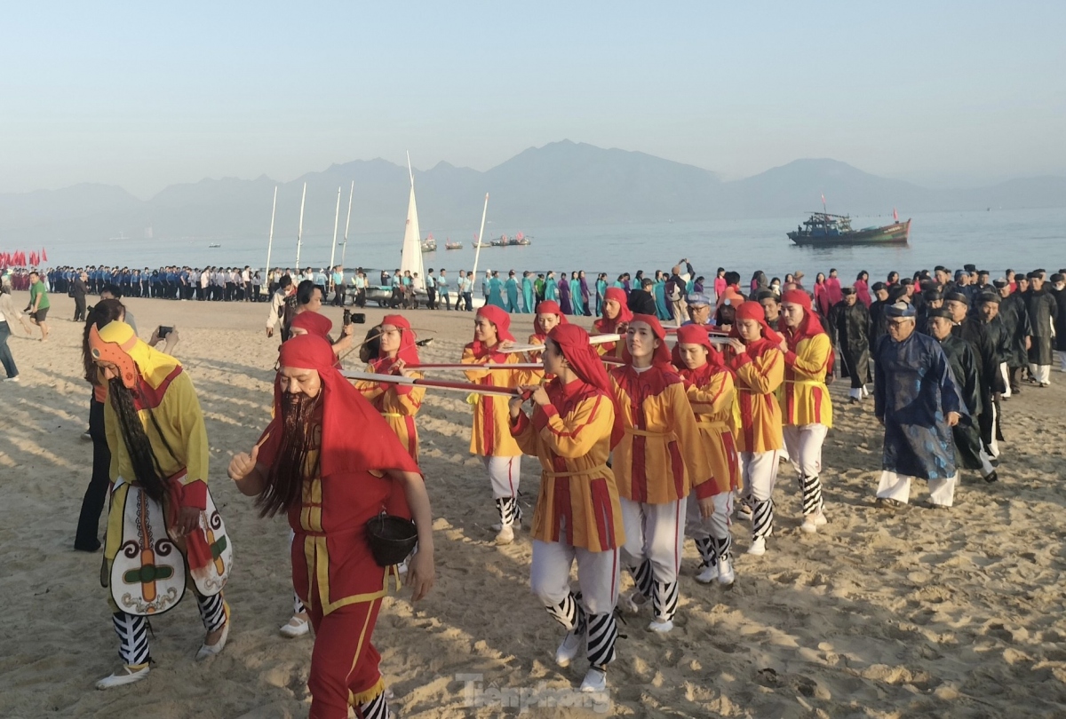 A procession of the god of the sea is carried by local fishermen as a prelude for the festival being held in Da Nang.