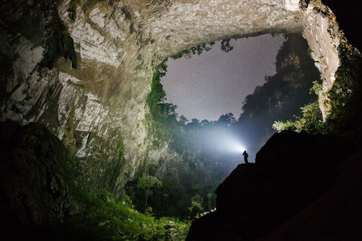 The cave stretches for nine kilometres long and is punctuated by two huge ceiling collapses which invite in natural light to pour into the cave.
