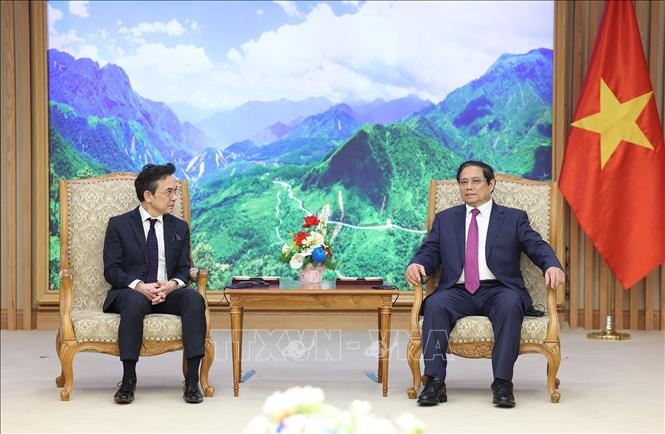 Thủ tướng Phạm Minh Chính và Đại sứ Thái Lan Nikorndej Balankura. Ảnh TTXVN