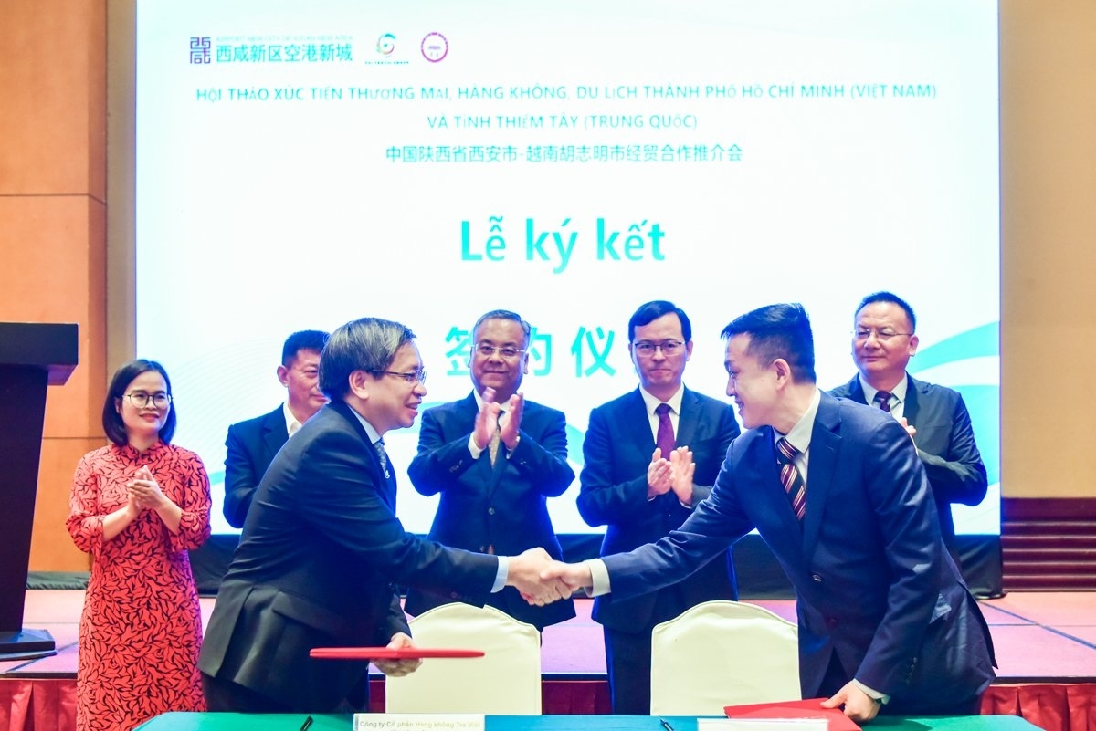 Vietnamese and Chinese businesses sign a co-operation agreement to further develop tourism services at a conference held in HCM City on March 21.