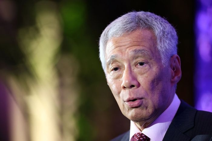 Ông Lý Hiển Long sẽ tiếp tục giữ vai trò Bộ trưởng cấp cao sau khi từ nhiệm. Ảnh: Bloomberg.