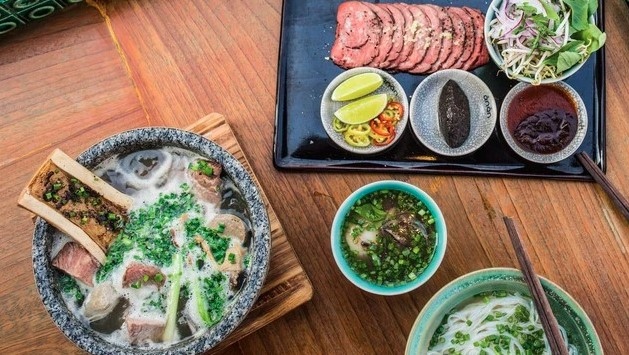 A bowl of pho is served at Pot Au Pho Restaurant