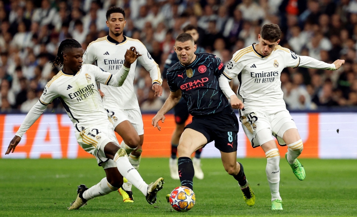 Man City và Real Madrid hòa kịch tính trên sân Bernabeu (Ảnh: Reuters)