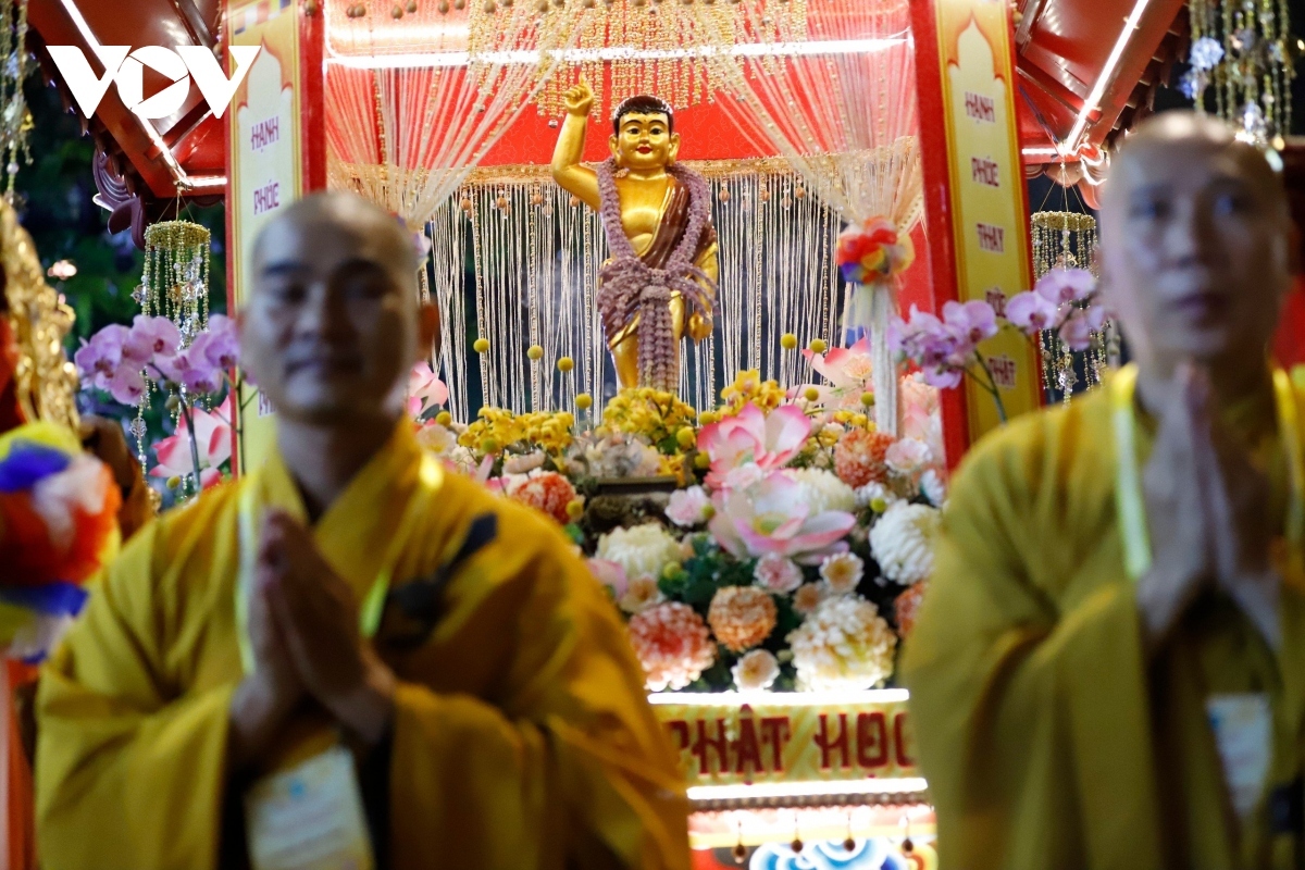 Monks carry a Buddha's statue during the parade.