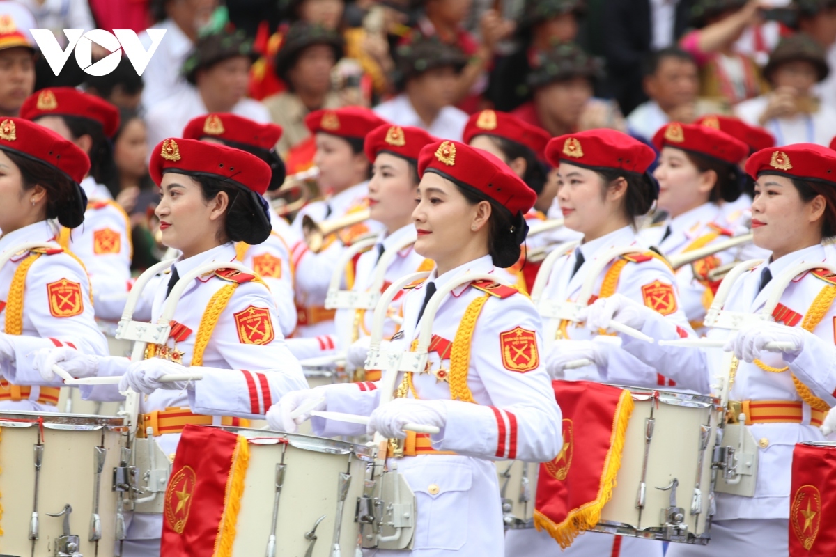 The women’s military band marches during the anniversary ceremony.