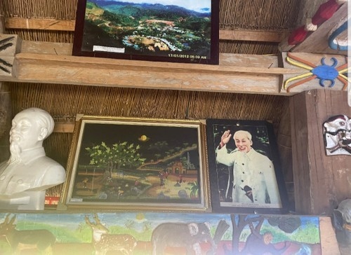 A bust and photo of President Ho Chi Minh are displayed in the Guol, the spiritual and cultural house of the Co Tu ethnic people in Lang commune, Tay Giang district, Quang Nam province.