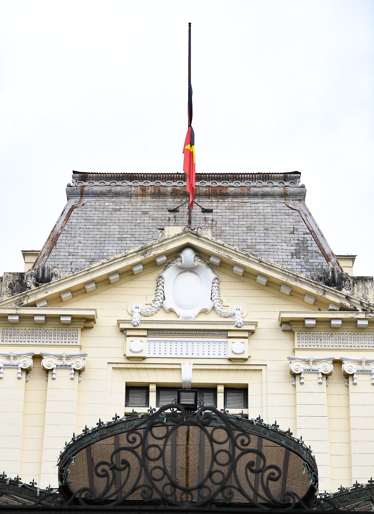 A view of the national flag flying at half-mast at the Government Guesthouse.
