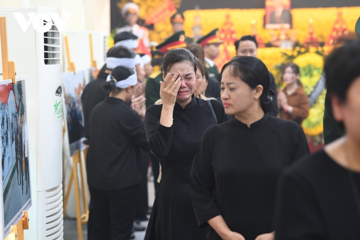 Many cannot hold back their tears at the somber ceremony.