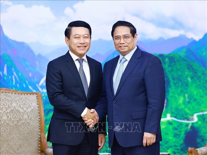 Thủ tướng Phạm Minh Chính tiếp Phó Thủ tướng Chính phủ, Bộ trưởng Ngoại giao Lào Saleumxay Kommasith. (Ảnh: TTXVN)