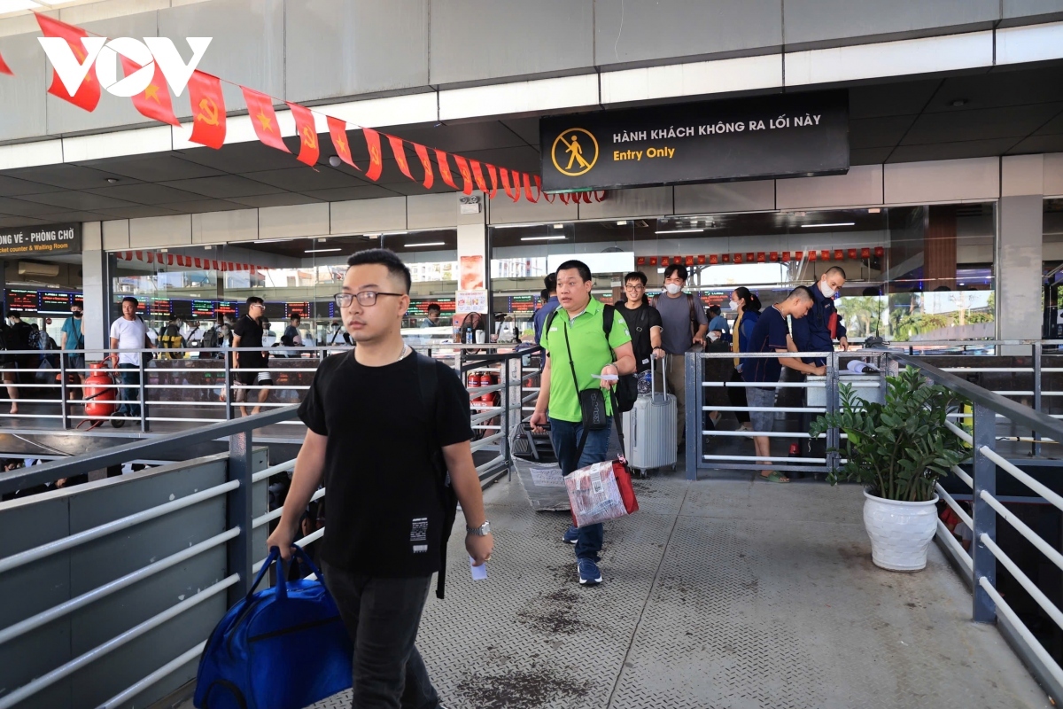 Passengers wait for their buses at Giap Bat Bus Station.
