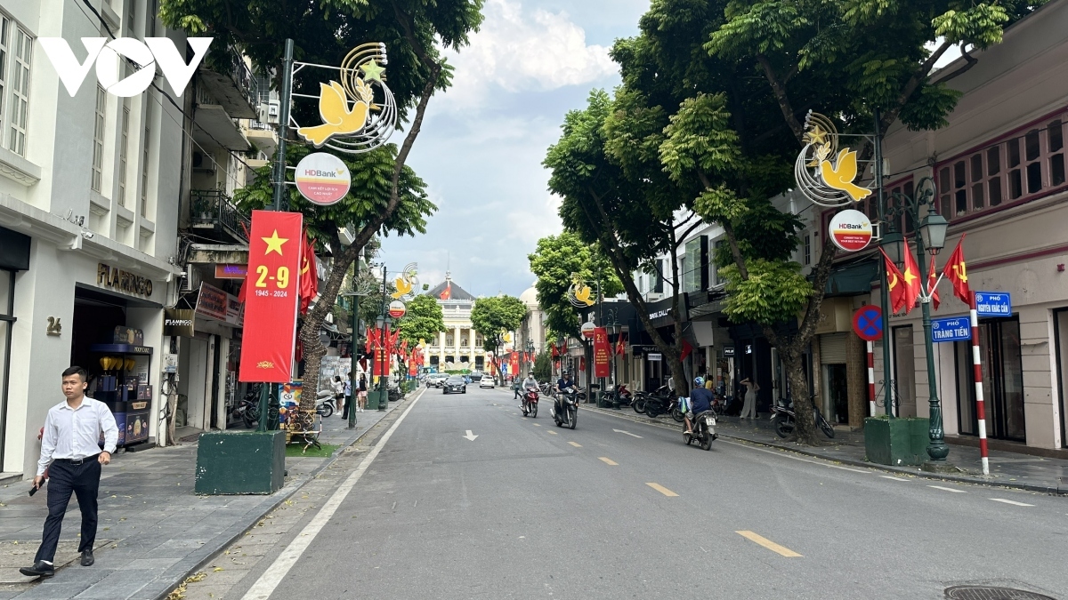 Plenty of national flags, banners, and slogans adorn Trang Tien street leading to the August Revolution Square in Hoan Kiem district in the heart of the capital.
