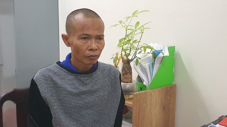Bị can Trần Doãn Tùng tại cơ quan công an. 
