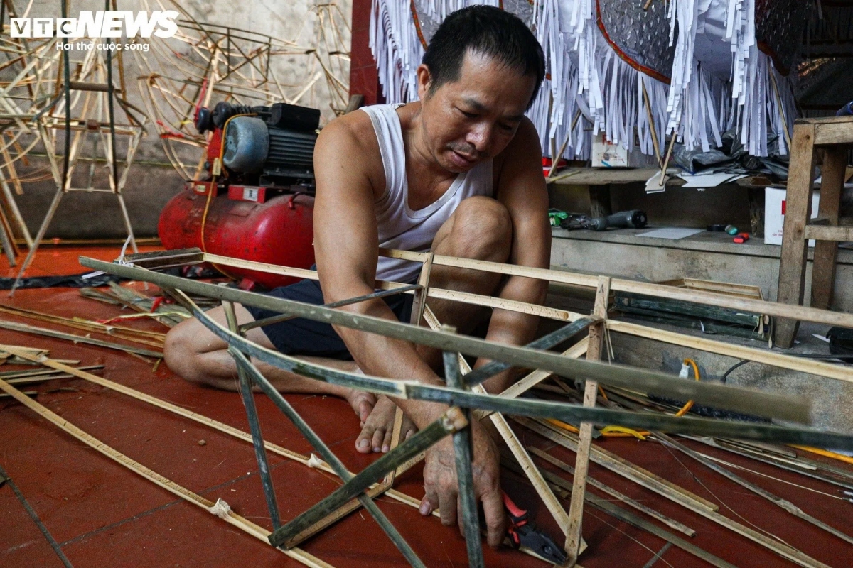 Nguyen The Hung is a local craftsman who has spent the last 30 years producing paper offerings. He says that he has received a huge number of orders over recent days.