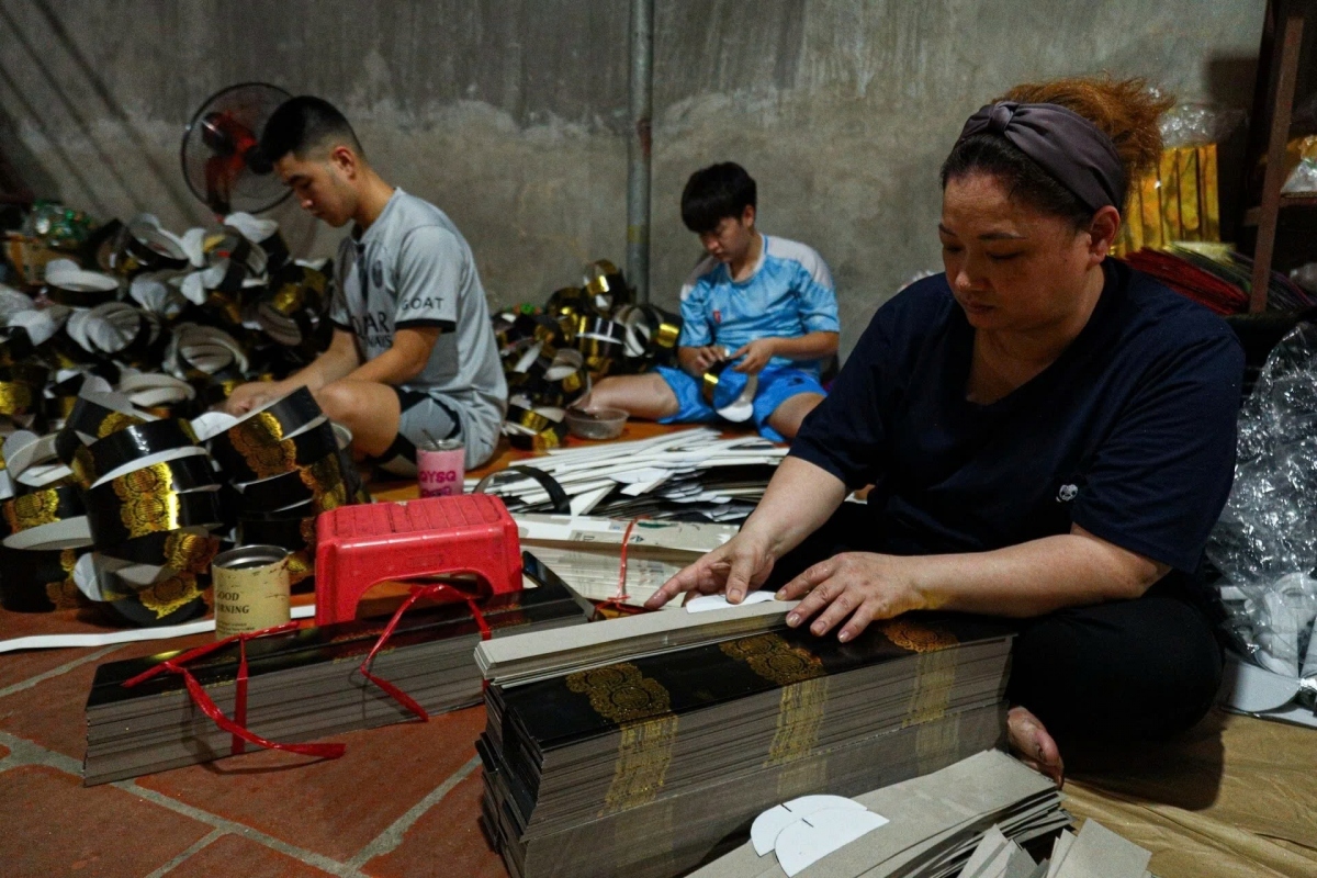 Local villagers are busy making paper models of earthly luxuries for those in the afterworld.