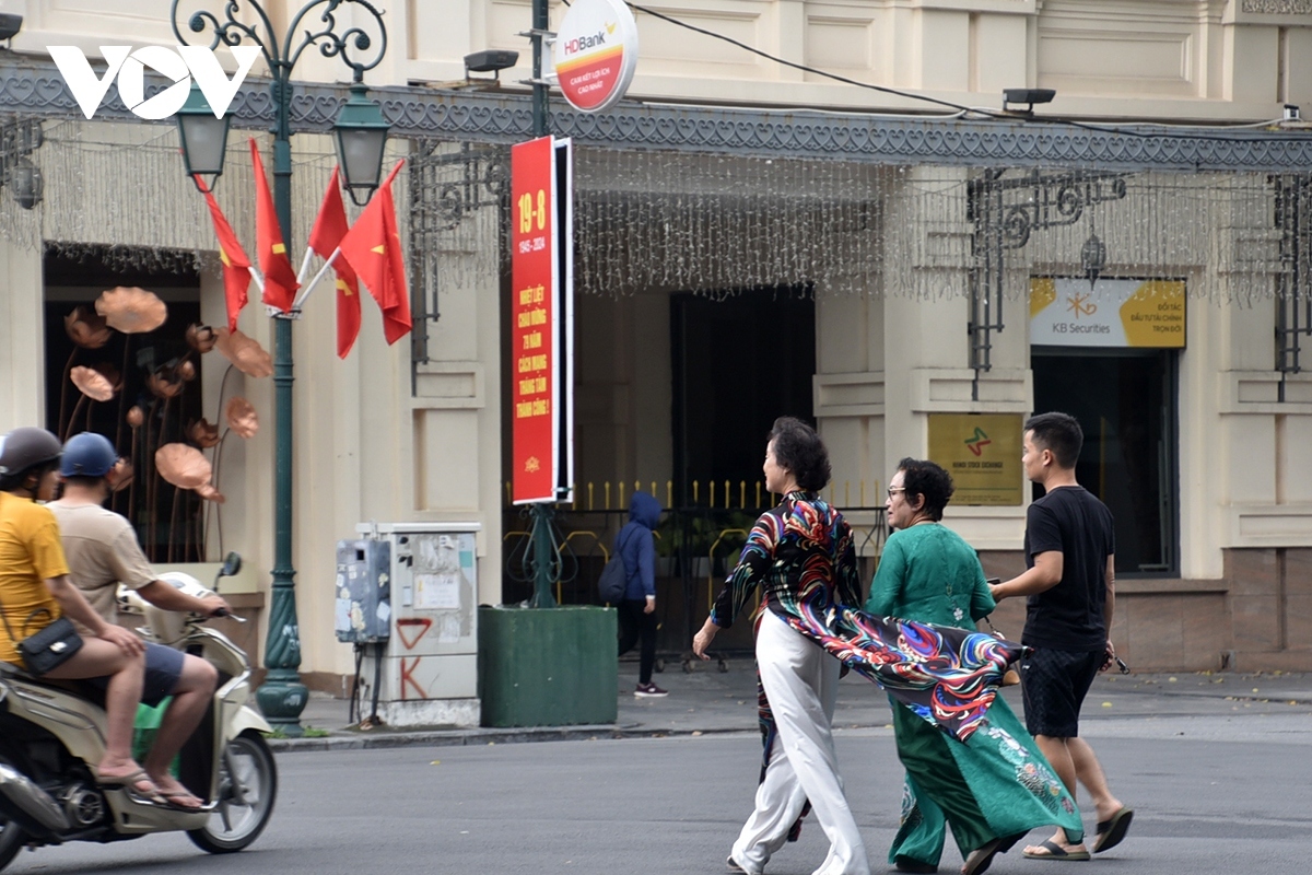 People take advantage of the quiet period by strolling around the street and enjoying the fresh, cool air.