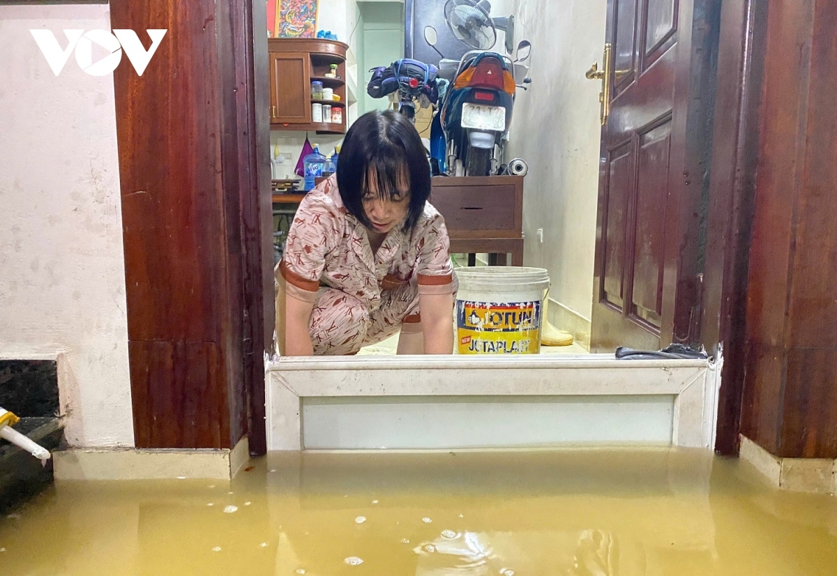 A resident seeks measures aimed at preventing floodwater entering her house.
