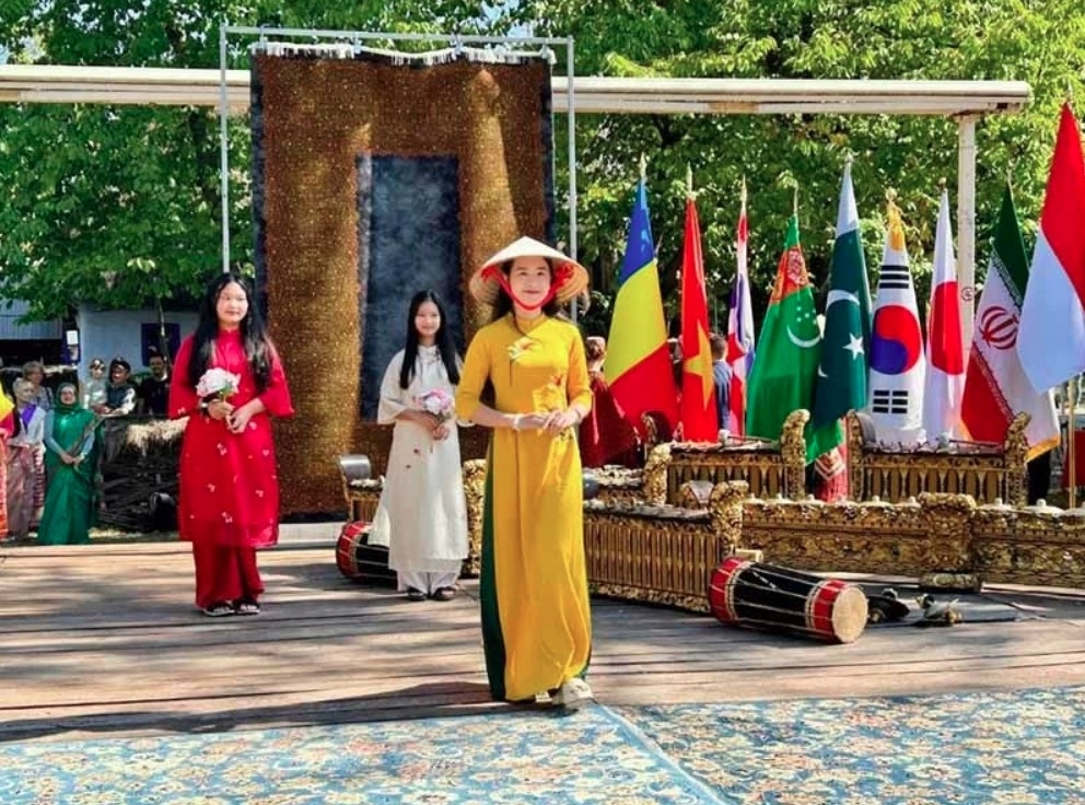 Locals modeling Ao Dai (traditional long dress) aim to introduce Vietnamese culture through the fashion show.