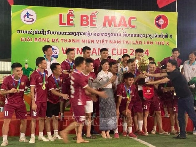 Young Vietnamese football players at the closing ceremony of the 10th Vietnam Youth Football Tournament in Laos.