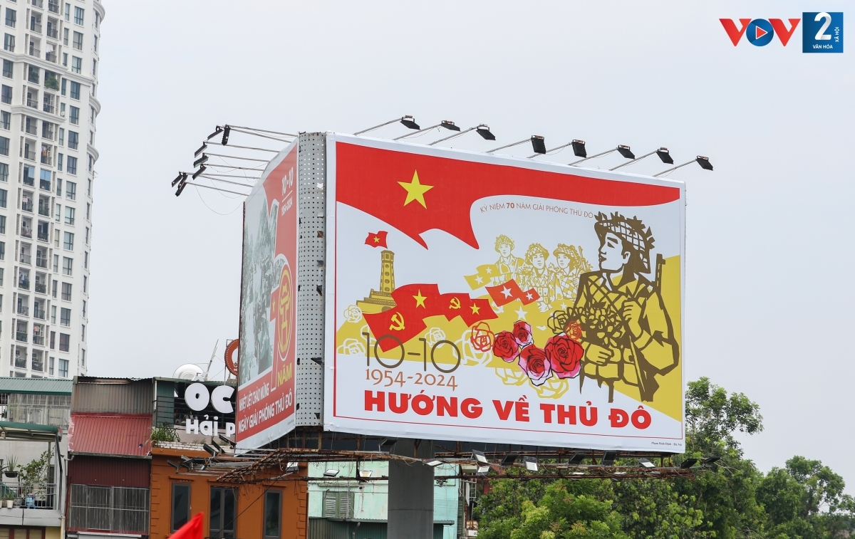 Posters and panels bearing messages praising Hanoi Liberation Day are put on display.