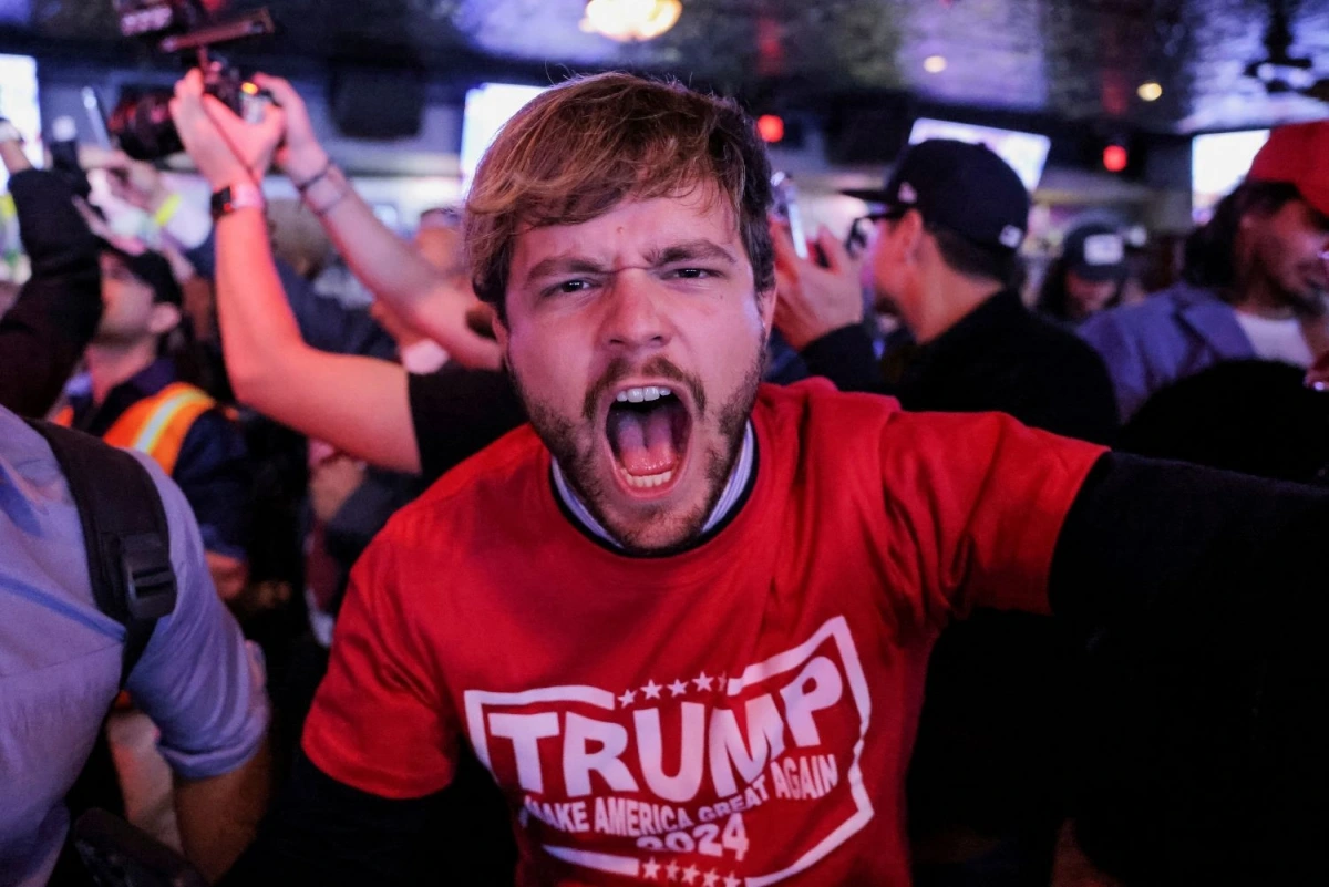 Người ủng hộ ông Trump ăn mừng chiến thắng (Ảnh: Reuters)